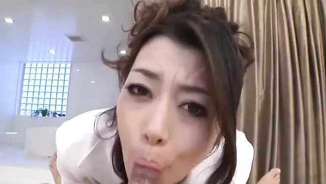 Japanese girl passionately sucking cock